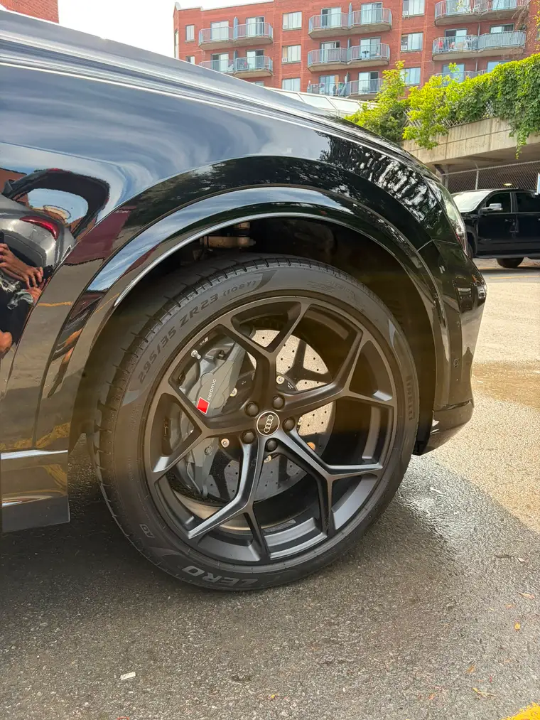 Audi RS wheel with red calipers and dressed tire