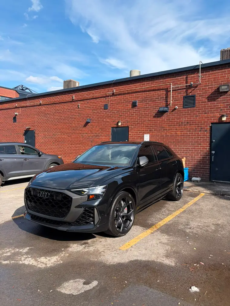Black Audi RS Q8 detailed and gleaming in a Montreal lot