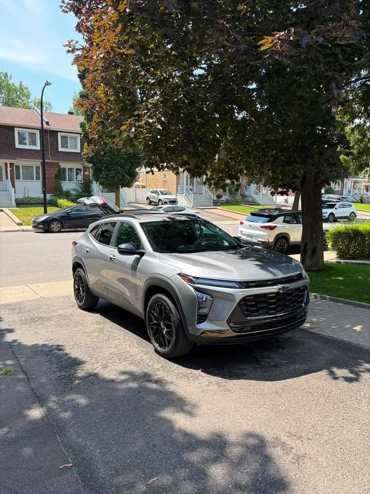 Silver Chevrolet Trax gleaming after a mobile detail on a Montreal residential street