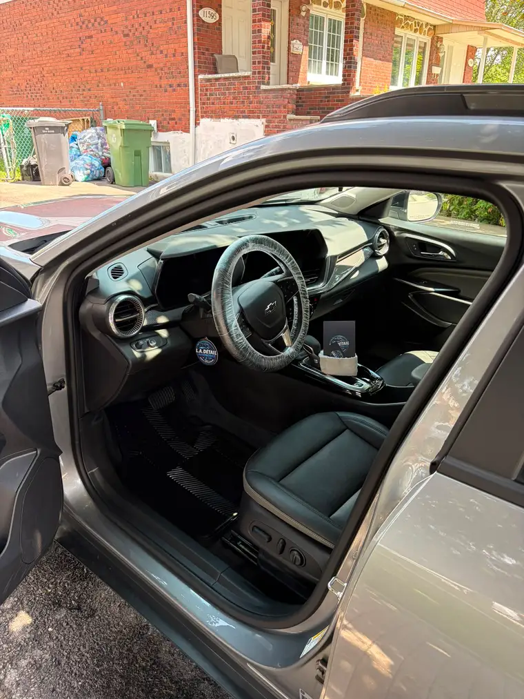 Chevrolet Trax interior freshly detailed, with a protective steering wheel cover still fitted