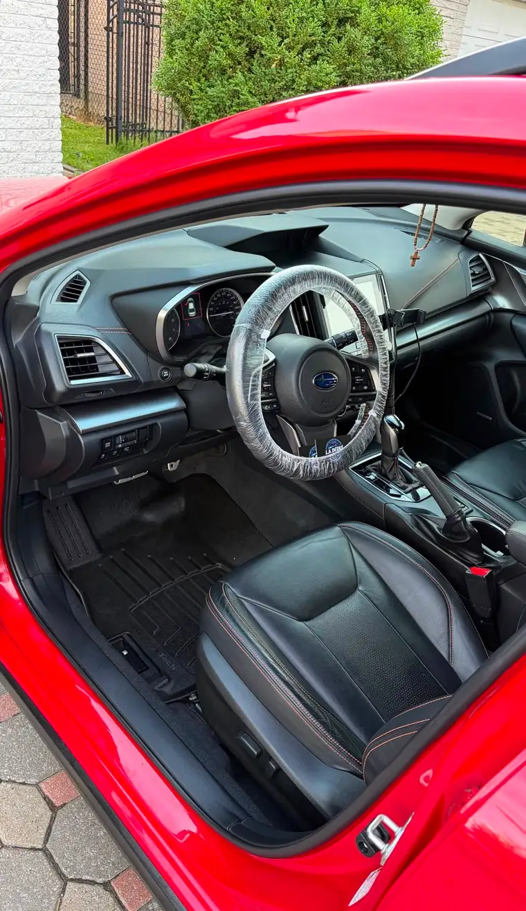 Red Subaru Crosstrek interior with spotless carpets after a deep clean