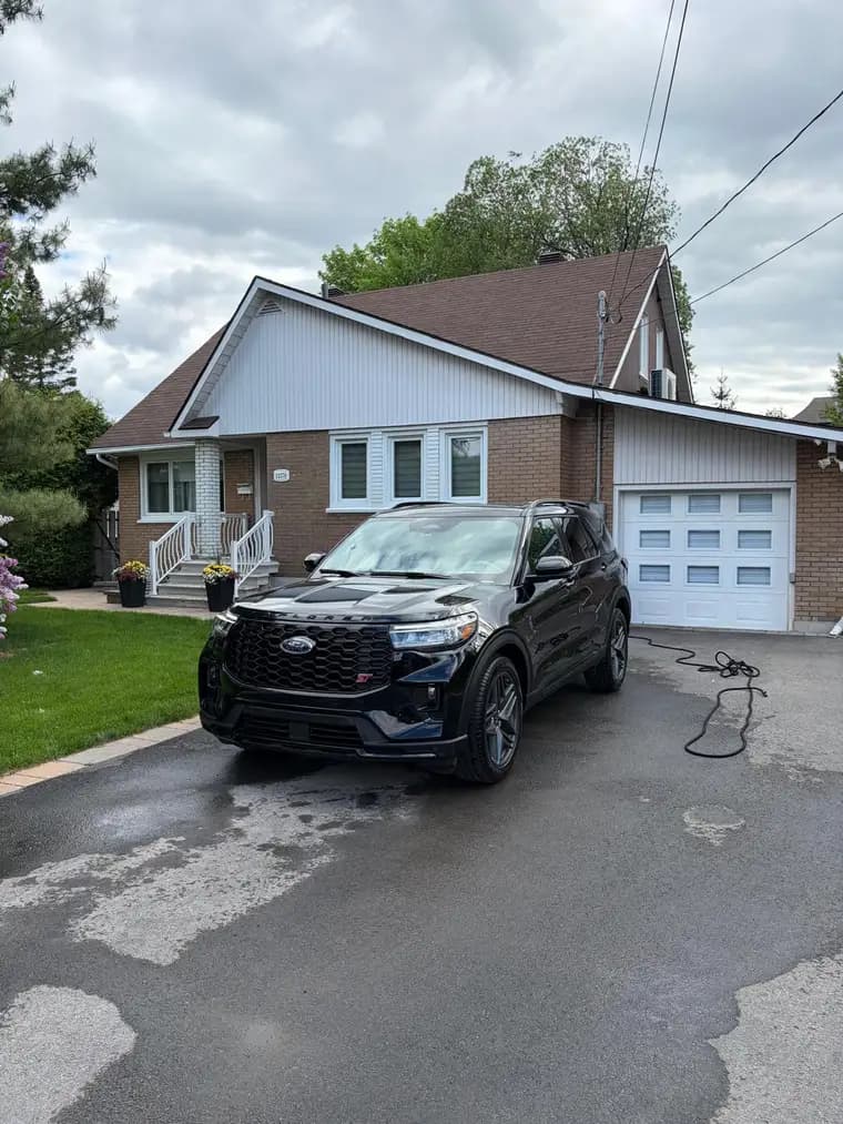 Black Ford Explorer ST washed and detailed in a residential driveway