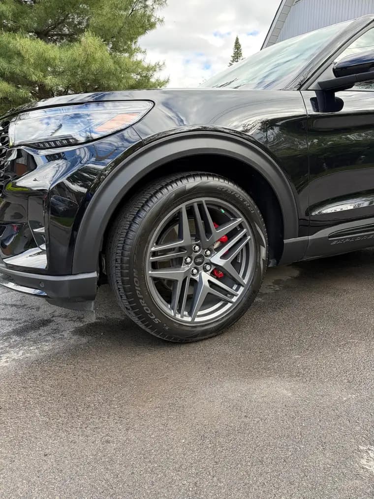 Ford Explorer ST wheel with red calipers, cleaned and dressed