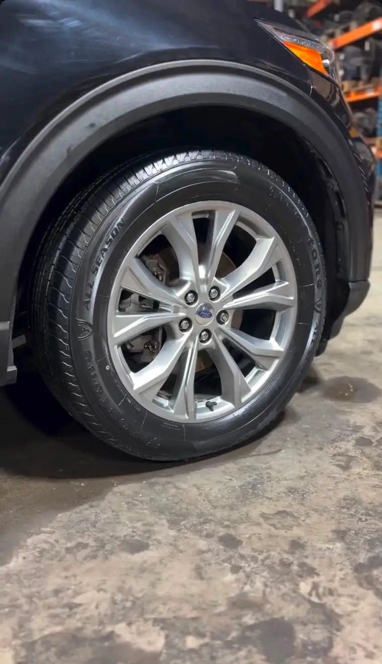 Ford wheel and tire dressed after an exterior detail