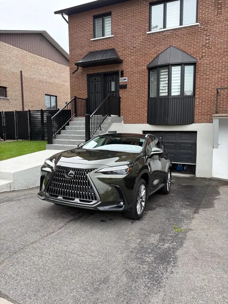 Olive green Lexus NX detailed in front of a Montreal home