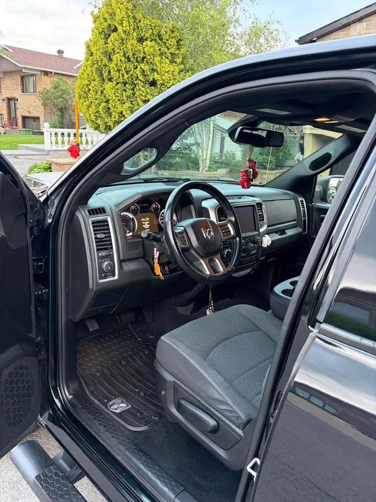 RAM 1500 cab interior with shampooed seats and floor mats
