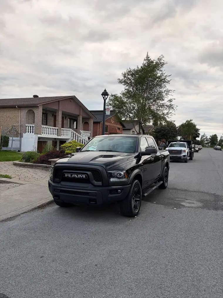 Black RAM 1500 Classic freshly detailed on a Montreal street