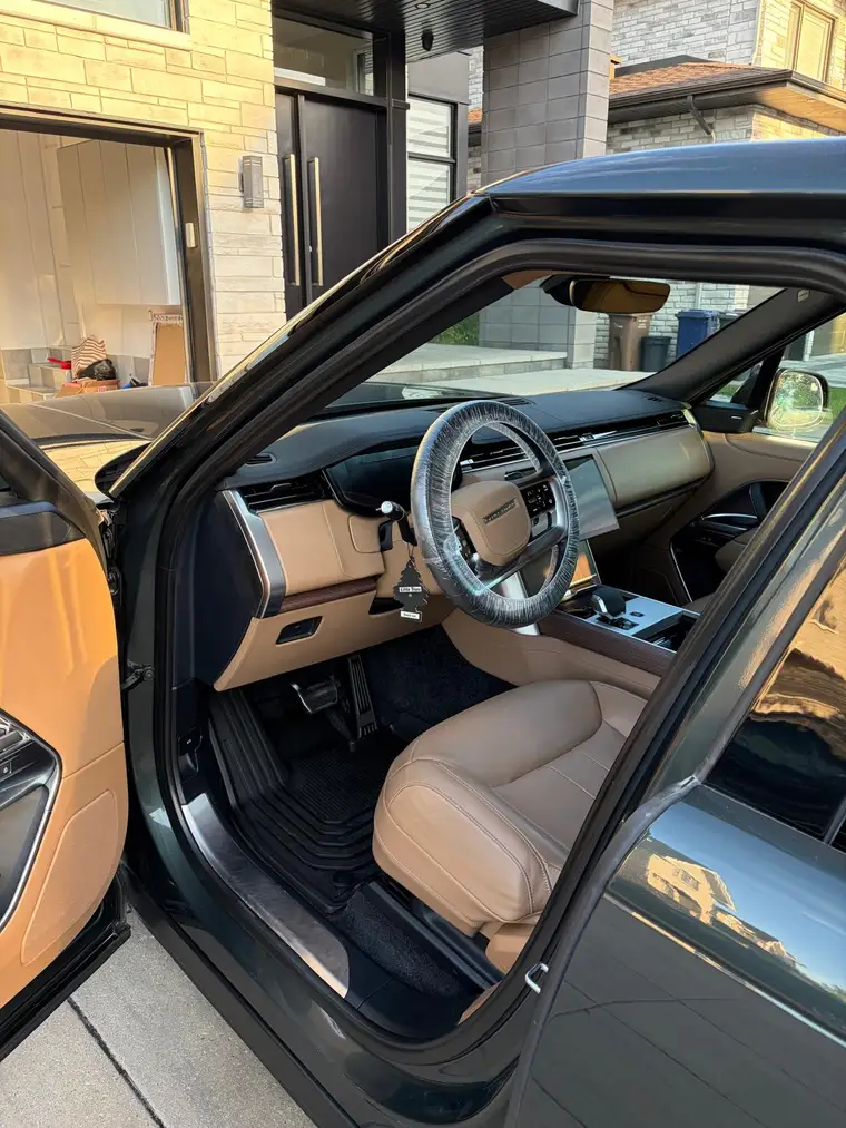 Range Rover interior with tan leather seats deep-cleaned and conditioned