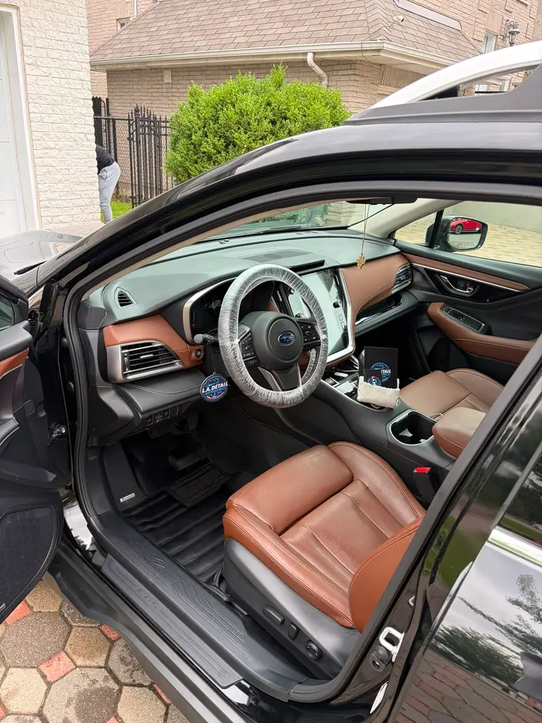 Subaru Outback interior with brown leather seats detailed to showroom condition